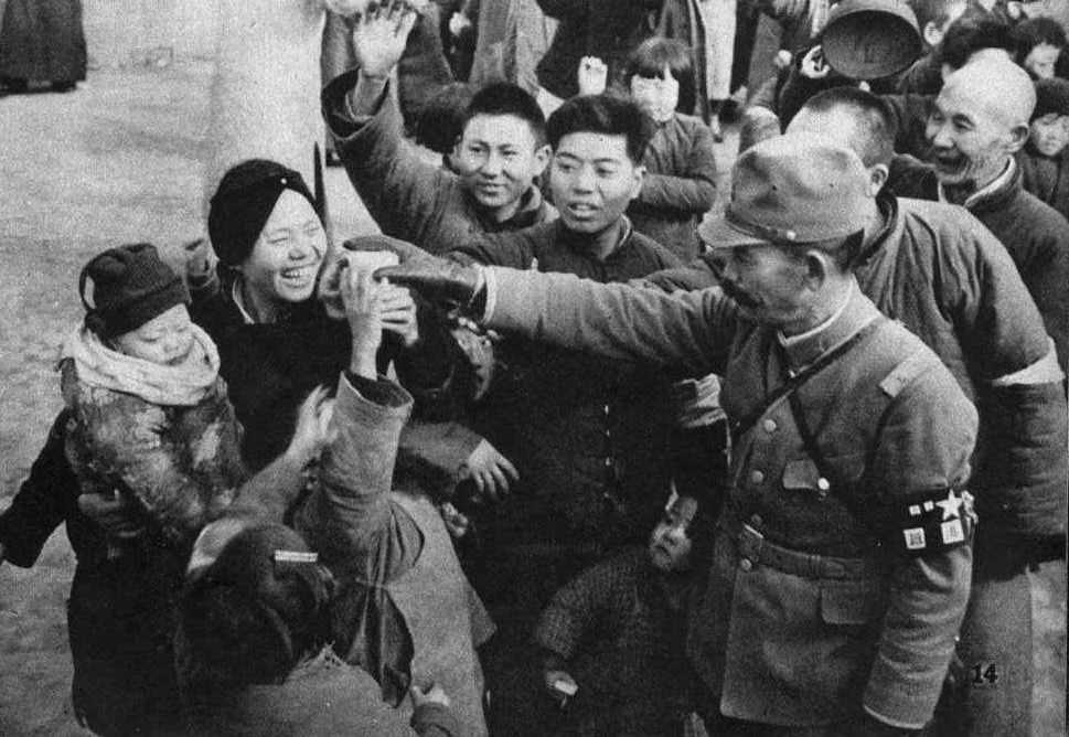 Dec 20th, 1938, in Nanking. Japanese Soldier giving to children the snack.
