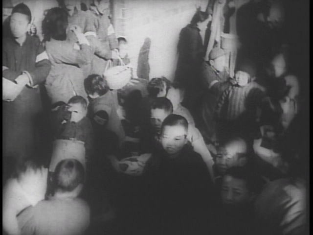 Dec, 1937,Scene of children with peoples in Nanking Safty Zone. By Documentary film "Nanking"1938.